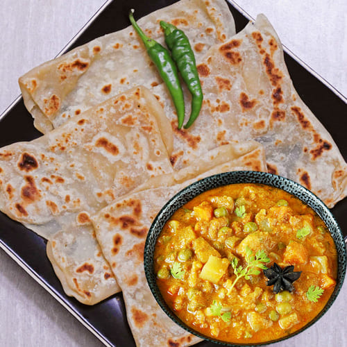 Veechu Parota with Veg Korma (1 Pc)